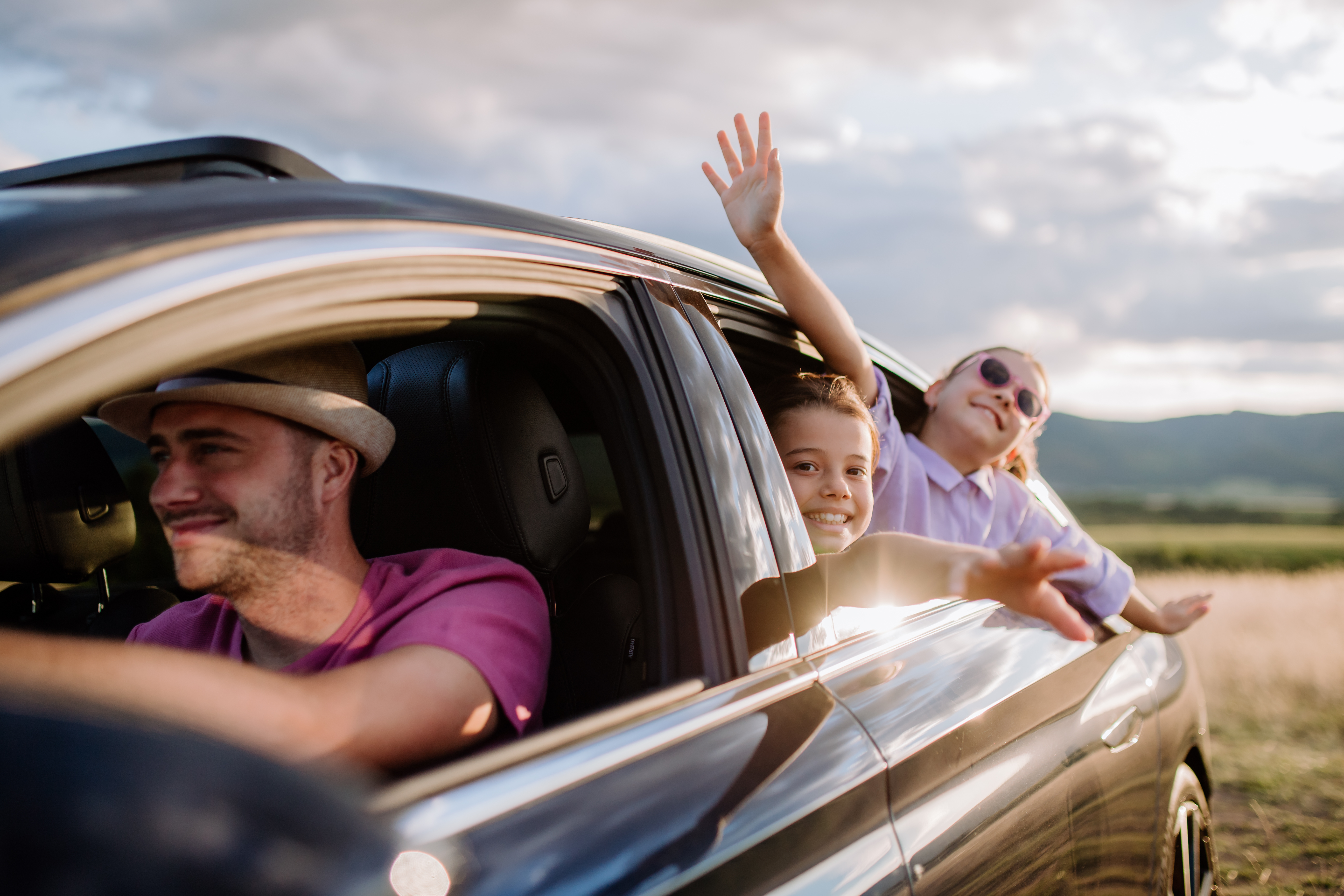 Family driving an EV